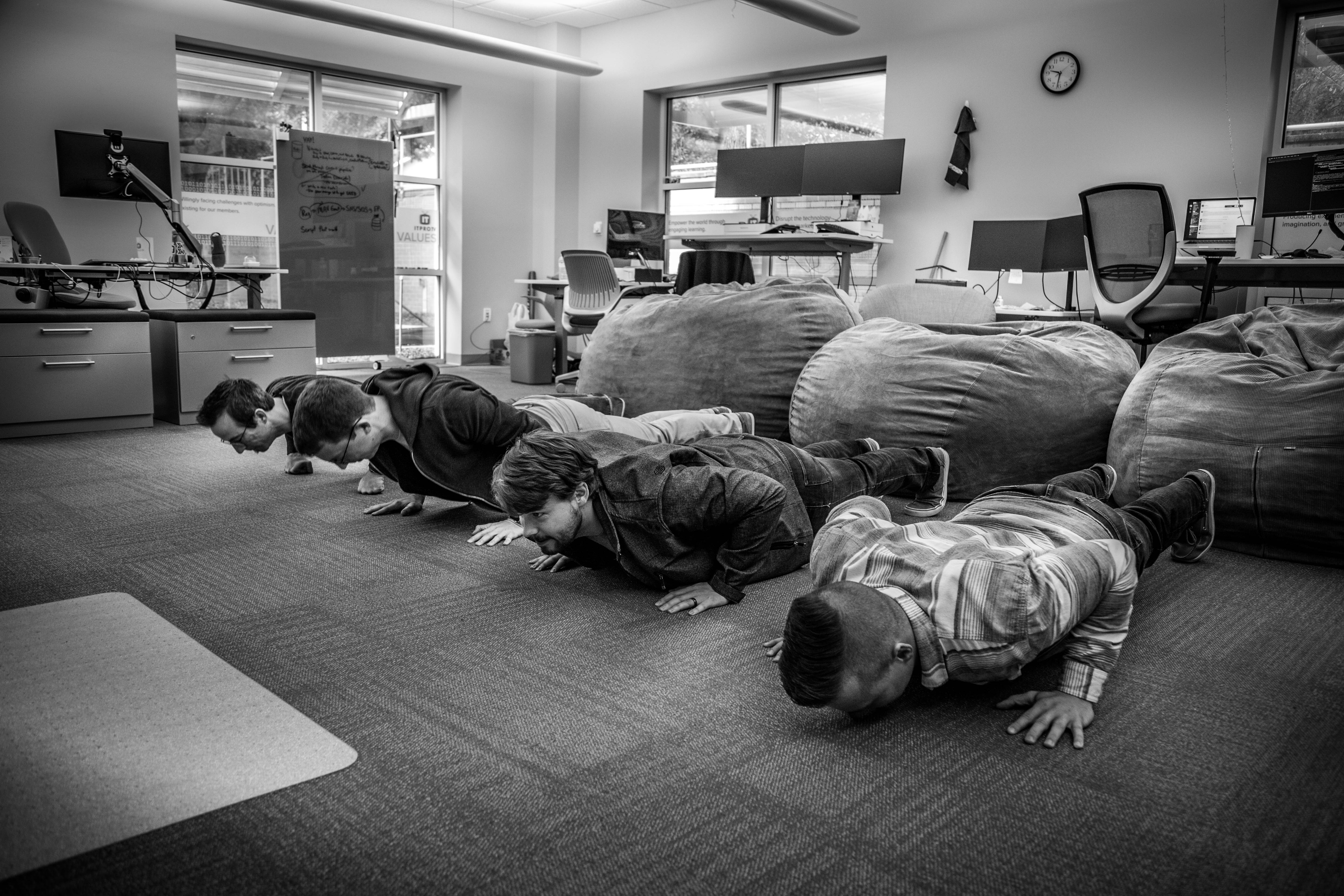 A photo of ITProTV Team doing push ups